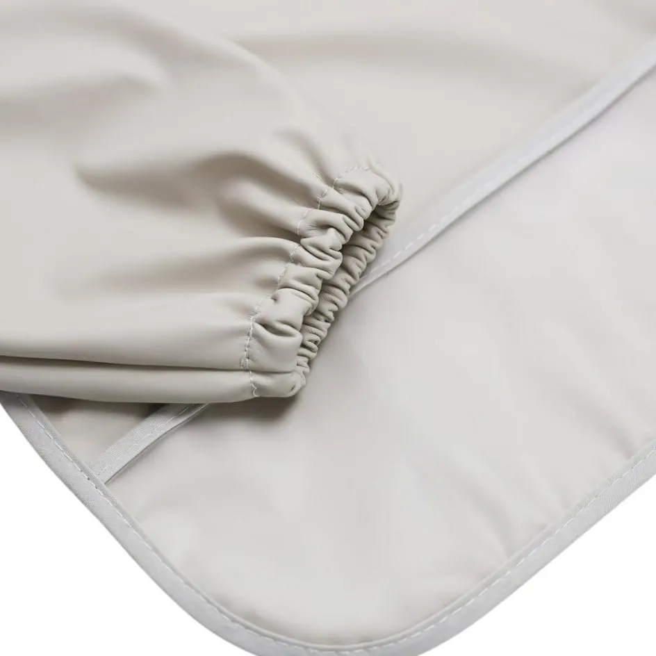 Best Trois Kilos Sept Bavoir plastifié manches longues Sable